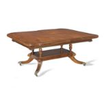 An Irish Regency mahogany and rosewood banded extending dining table possibly by Mack, Williams a...