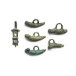 A group of six Roman bronze phallic amulets 6