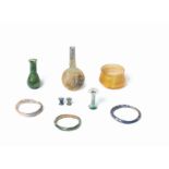 A group of seven Roman glass artefacts and a pair of Chinese blue glass ear ornaments, 9