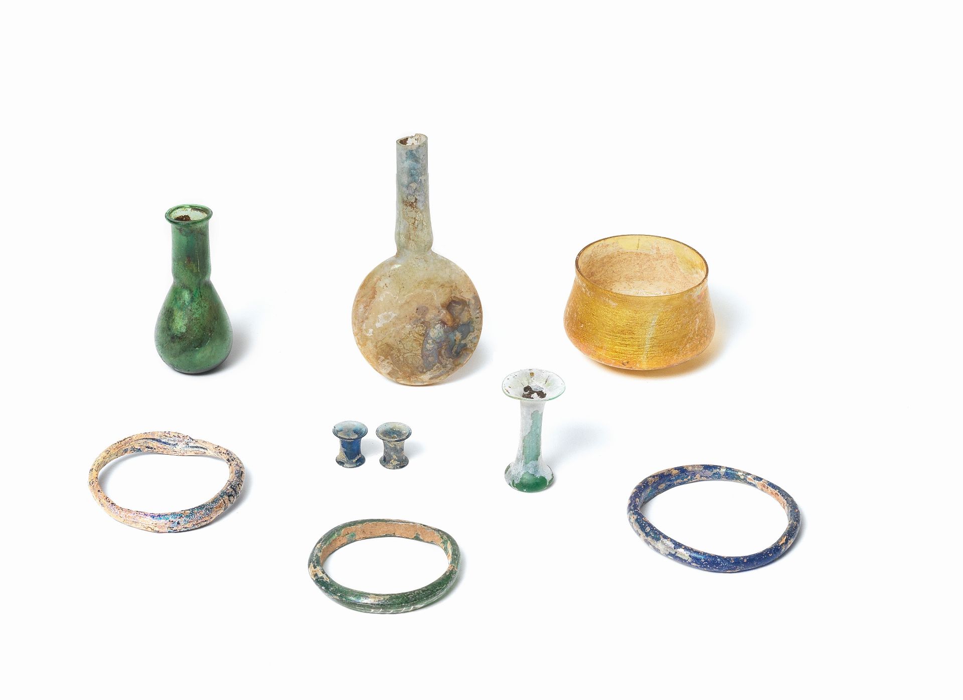 A group of seven Roman glass artefacts and a pair of Chinese blue glass ear ornaments, 9
