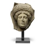 An Etruscan terracotta votive head of a woman