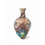 A Roman purple glass pine cone-shaped bottle