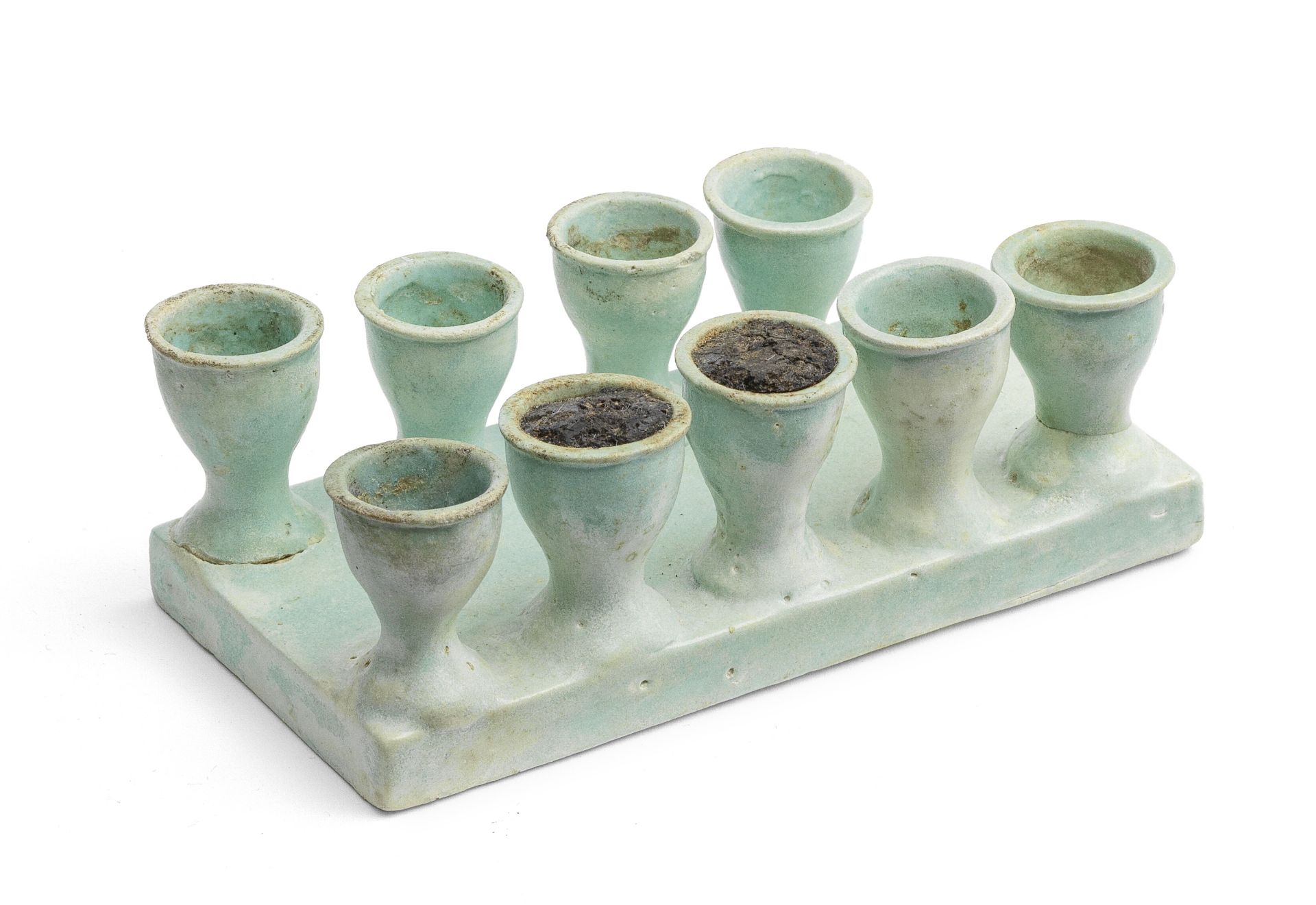 An Egyptian pale turquoise glazed composition model offering tray
