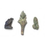 An Egyptian lapis lazuli vulture amulet and an Egyptian miniature iridescent glass Osiris amulet ...