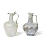 Two Roman pale green glass jugs 2