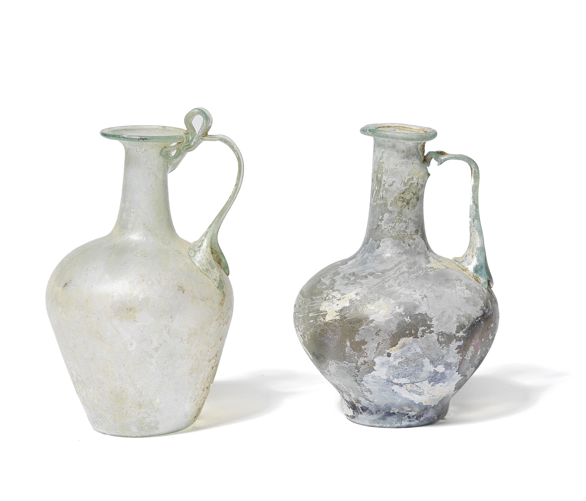 Two Roman pale green glass jugs 2