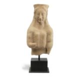 A large Greek terracotta bust of a kore