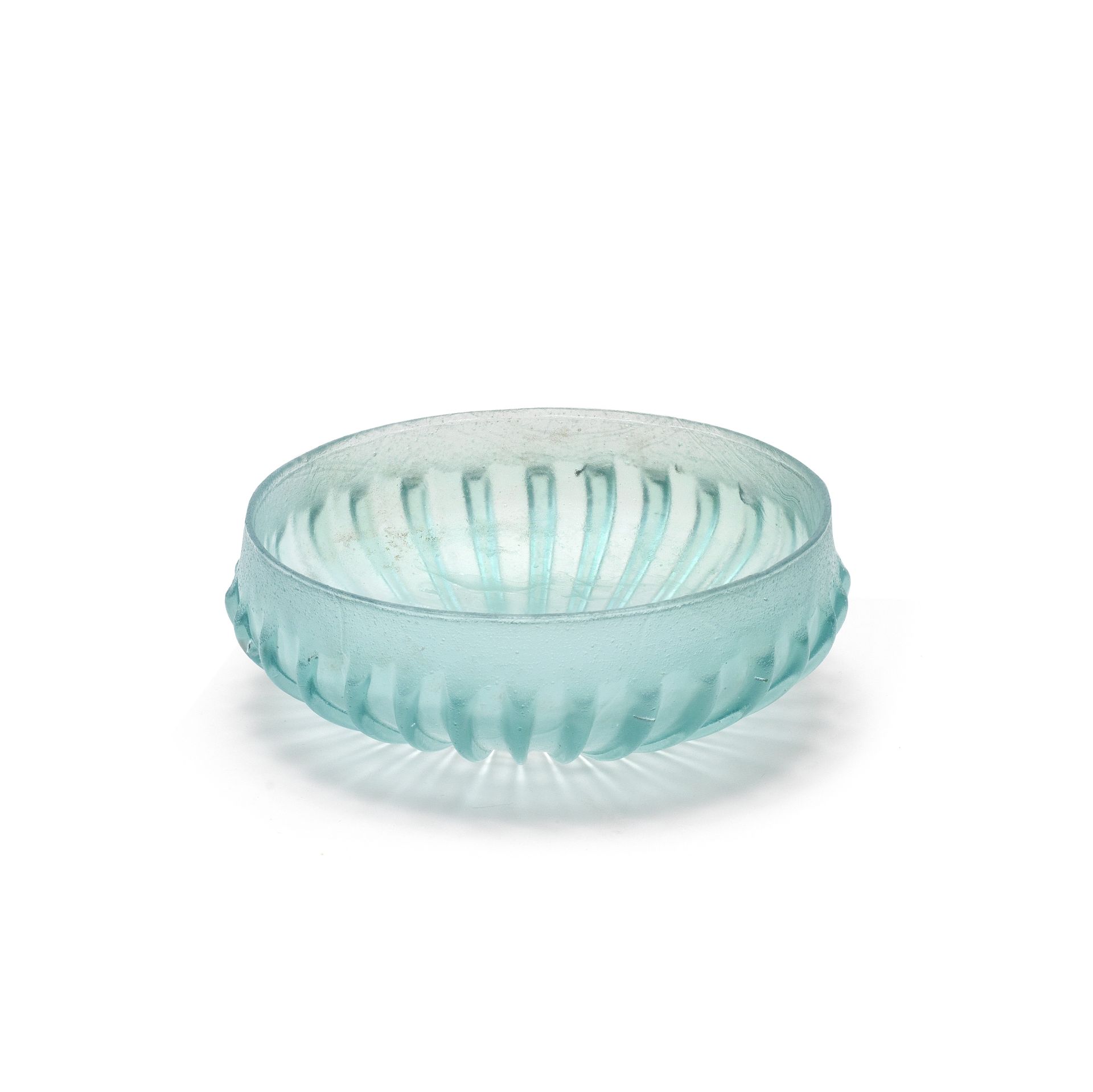 A Roman blue-green glass ribbed bowl