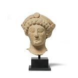 A Greek terracotta female head