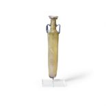 A Roman amber glass flask