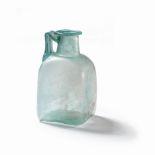 A Roman pale blue square glass jug
