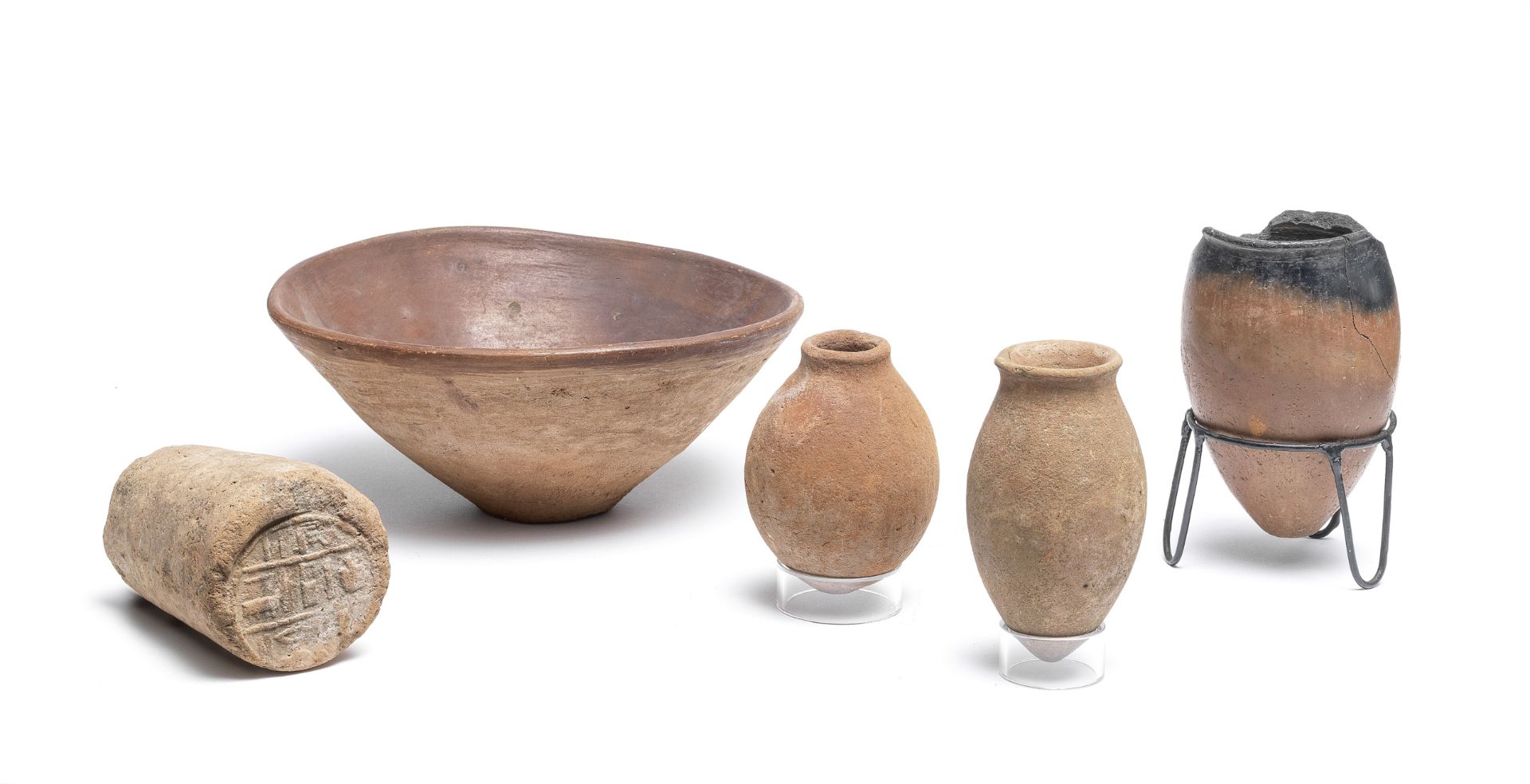Four Egyptian pottery vessels together with an Egyptian clay funerary cone, 5