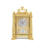 A Fine mid 19th century English gilt and engraved brass Egyptian style timepiece with calendar, i...