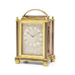 A mid 19th century patinated and engraved gilt brass carriage timepiece