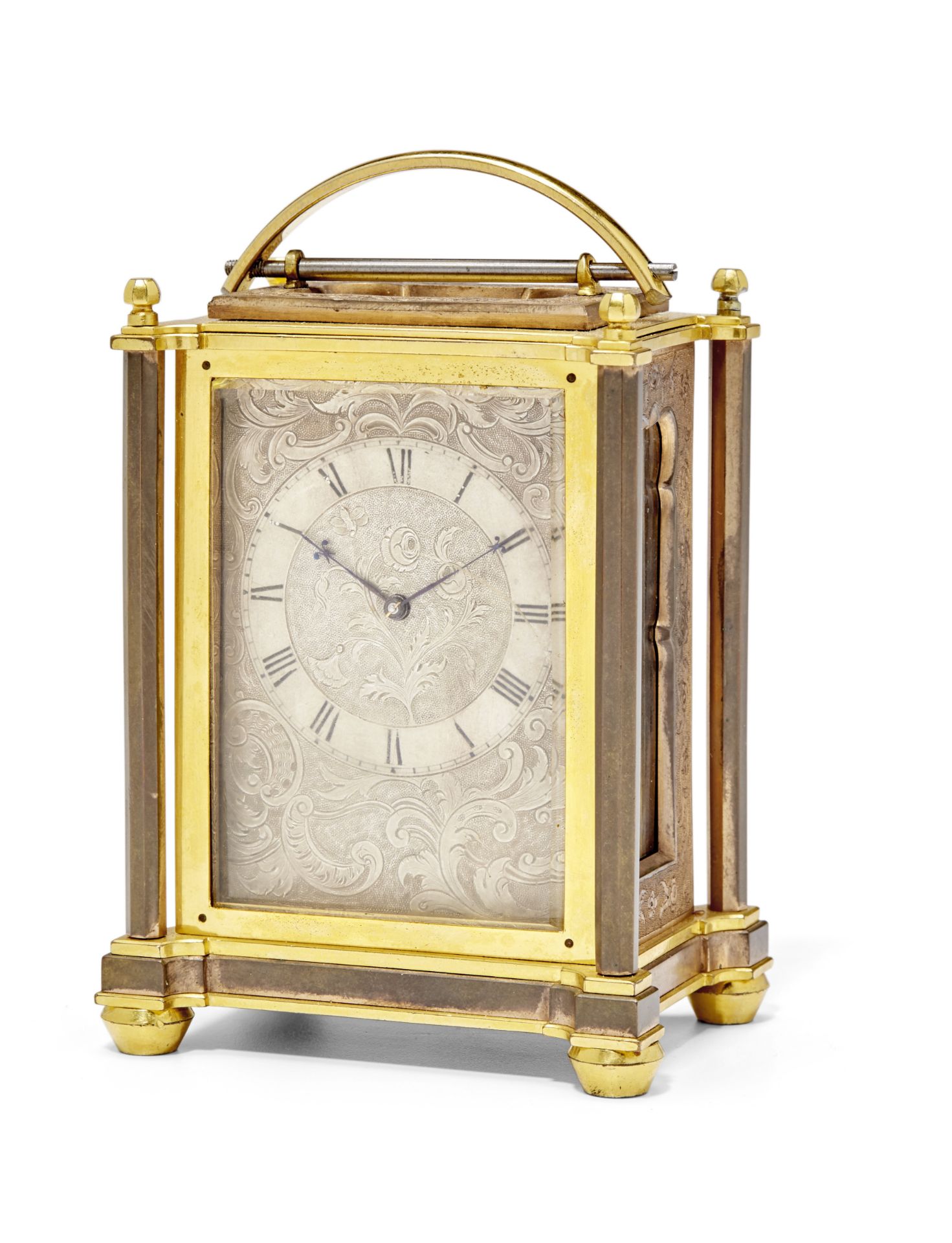 A mid 19th century patinated and engraved gilt brass carriage timepiece