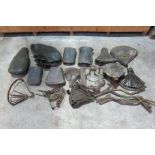 A quantity of saddles, saddle covers, and saddle components ((Qty))