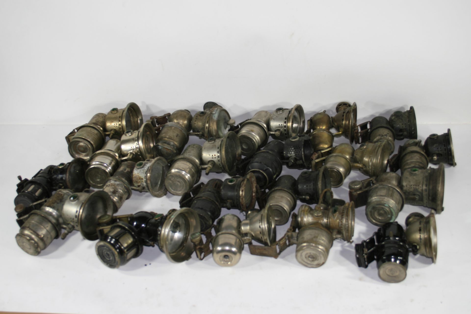 A collection of twenty acetylene generated cycle lamps, ((Qty))