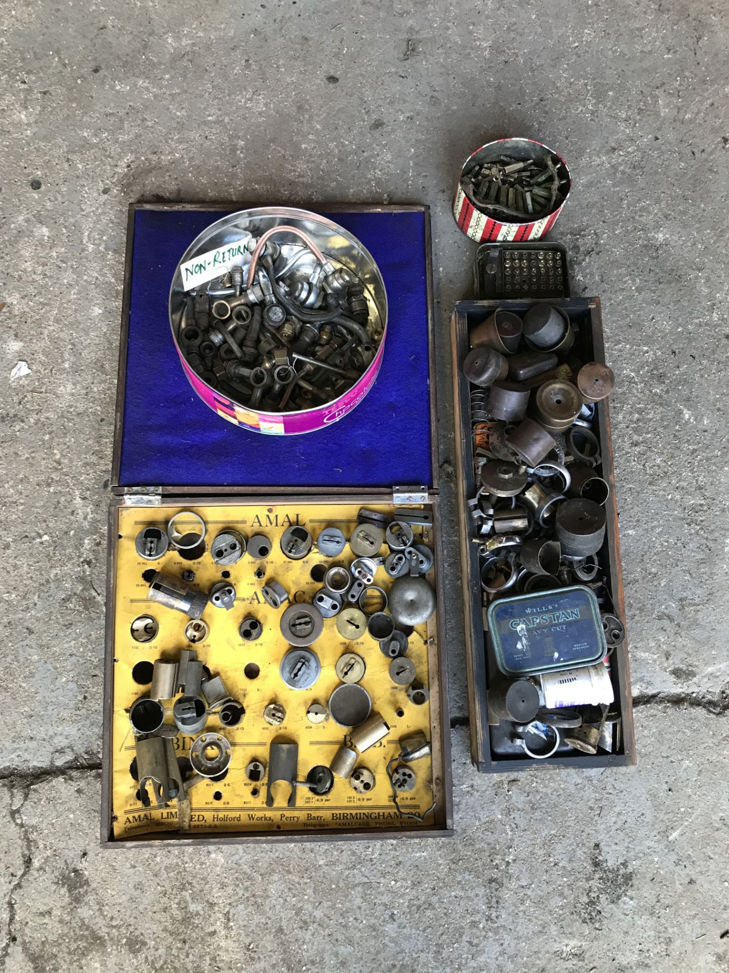 A selection of carburettor and float chamber parts