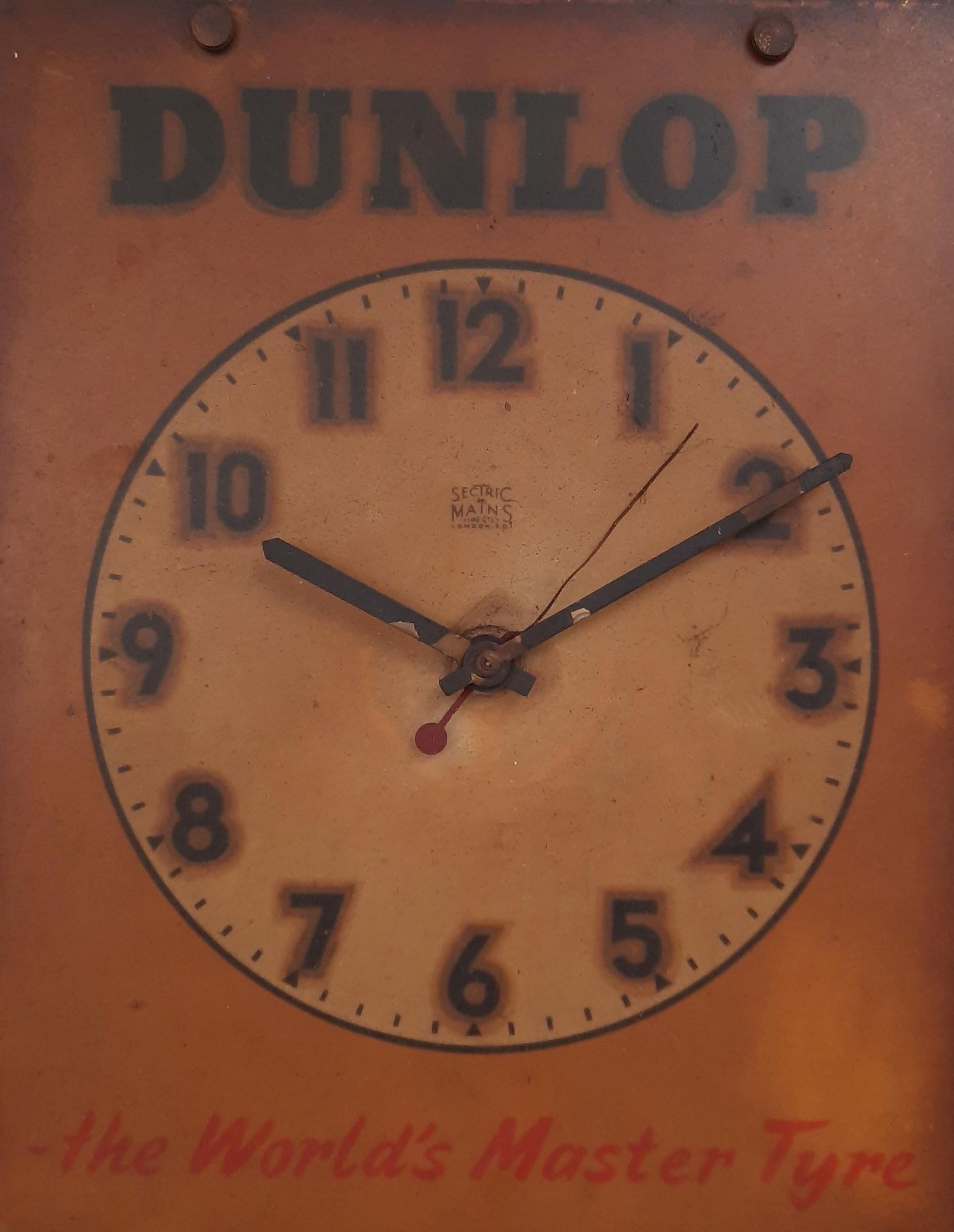 A rare late 1920s/early 1930s Dunlop Sectric wall hanging garage clock