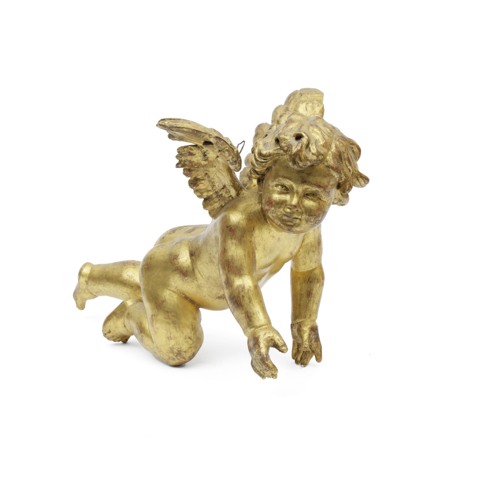 A carved giltwood putti together with a red velvet panel embroidered with a coat of arms 19th cen...