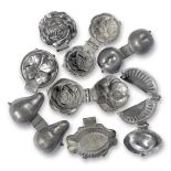 A collection of eight Victorian hinged pewter ice-cream moulds (8)
