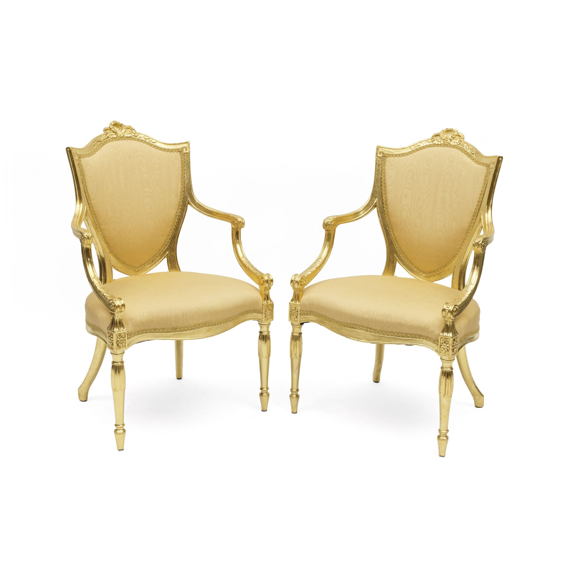 A pair of George III carved giltwood open armchairs In the manner of James Wyatt (2)