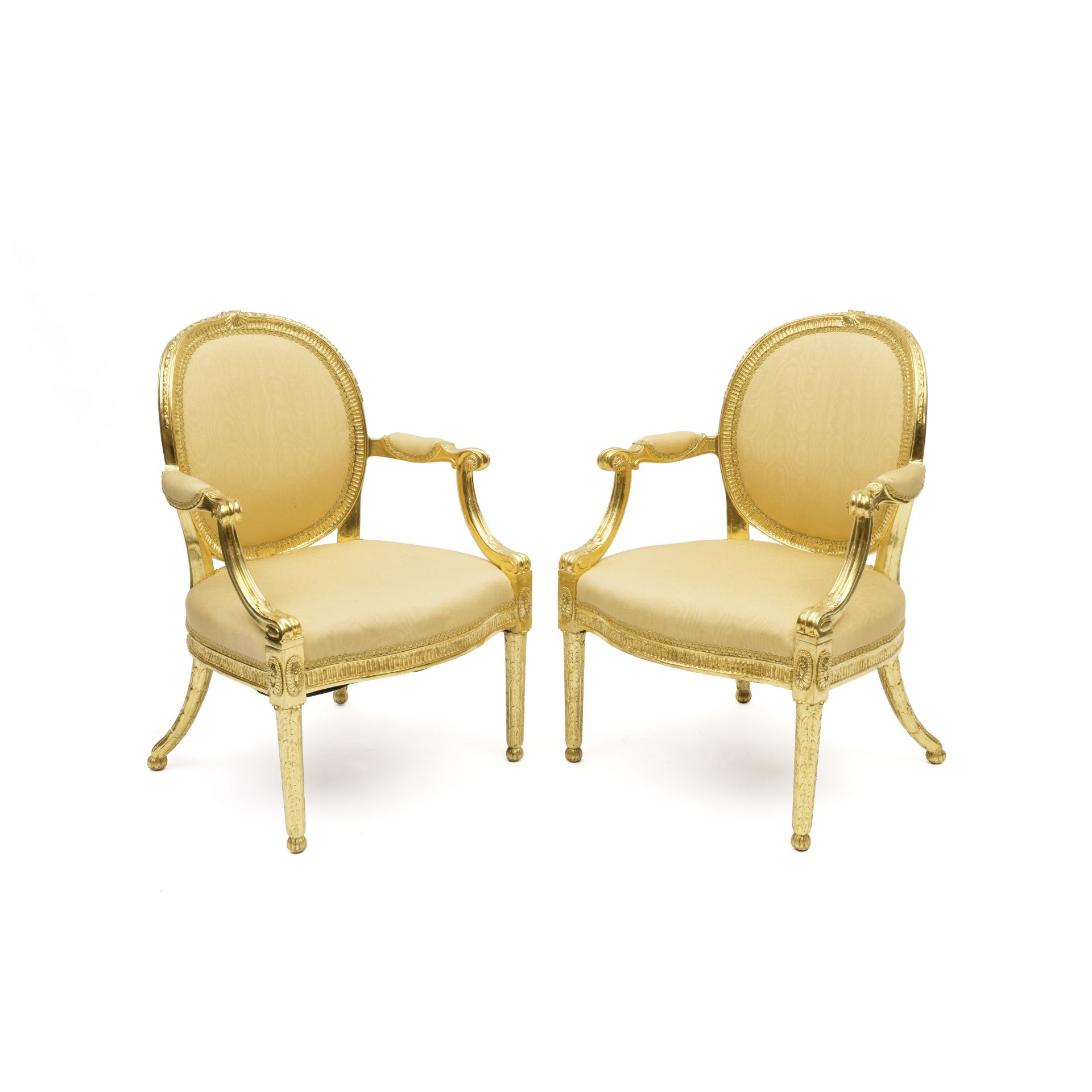 A pair of George III giltwood open armchairs In the manner of Thomas Chippendale, late 18th centu...