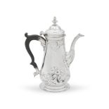 A George II silver coloured metal coffee pot
