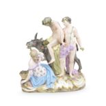 A Meissen group of the drunken Silenus, late 19th century, together with three Meissen figures, 1...