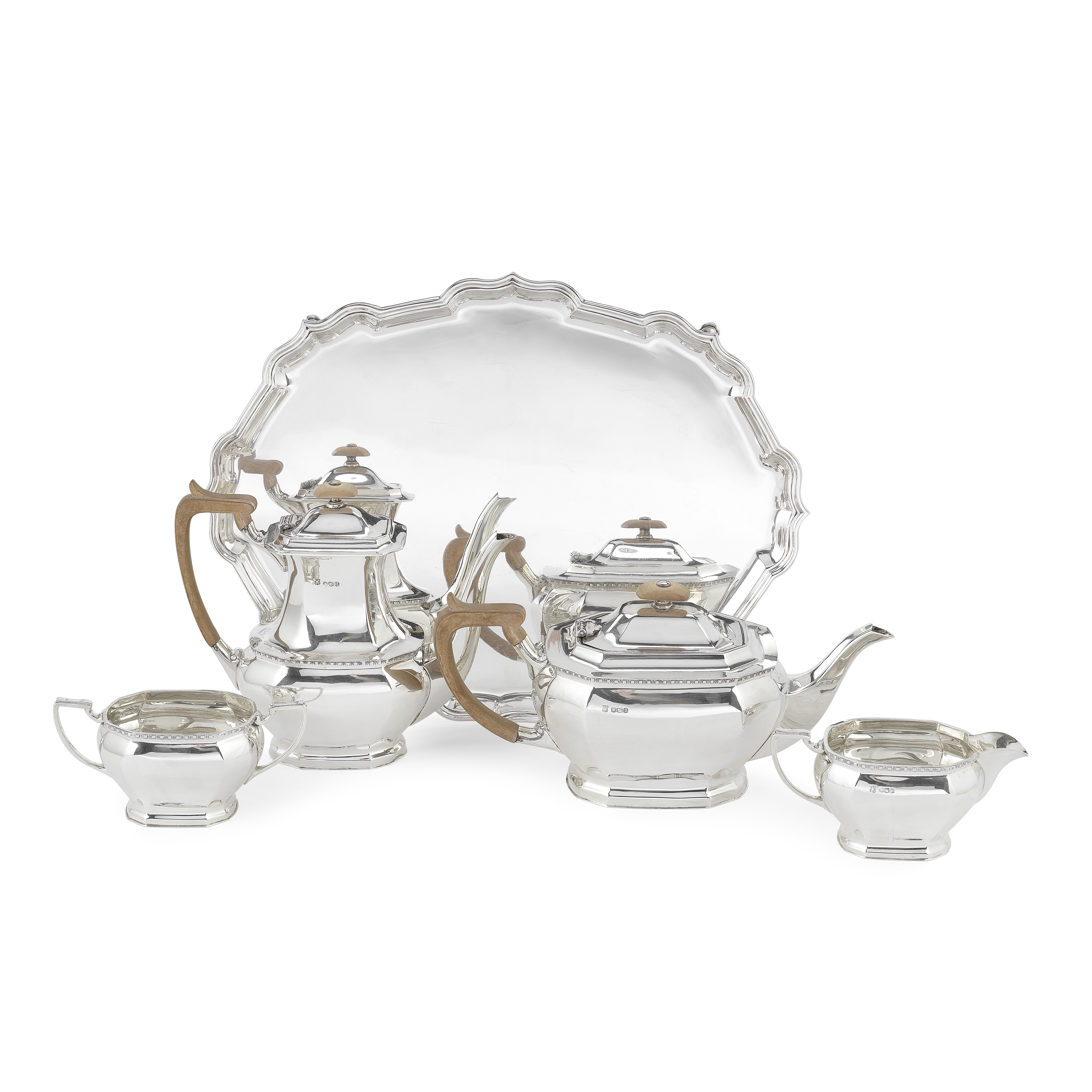 A silver four-piece tea and coffee service together with a tray Cooper Brothers & Sons Ltd, Sheff...