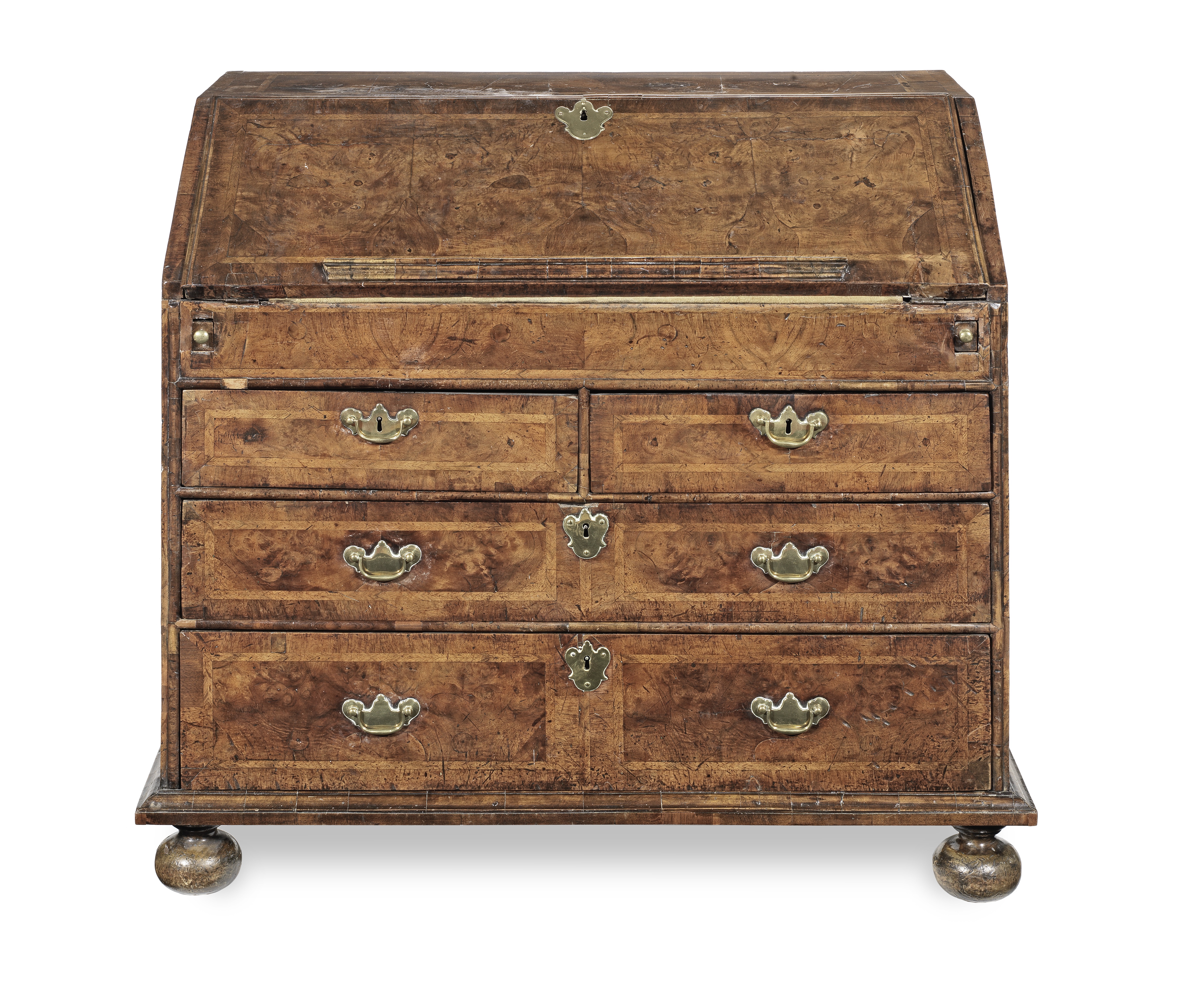 A Queen Anne walnut and featherbanded bureau