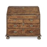 A Queen Anne walnut and featherbanded bureau