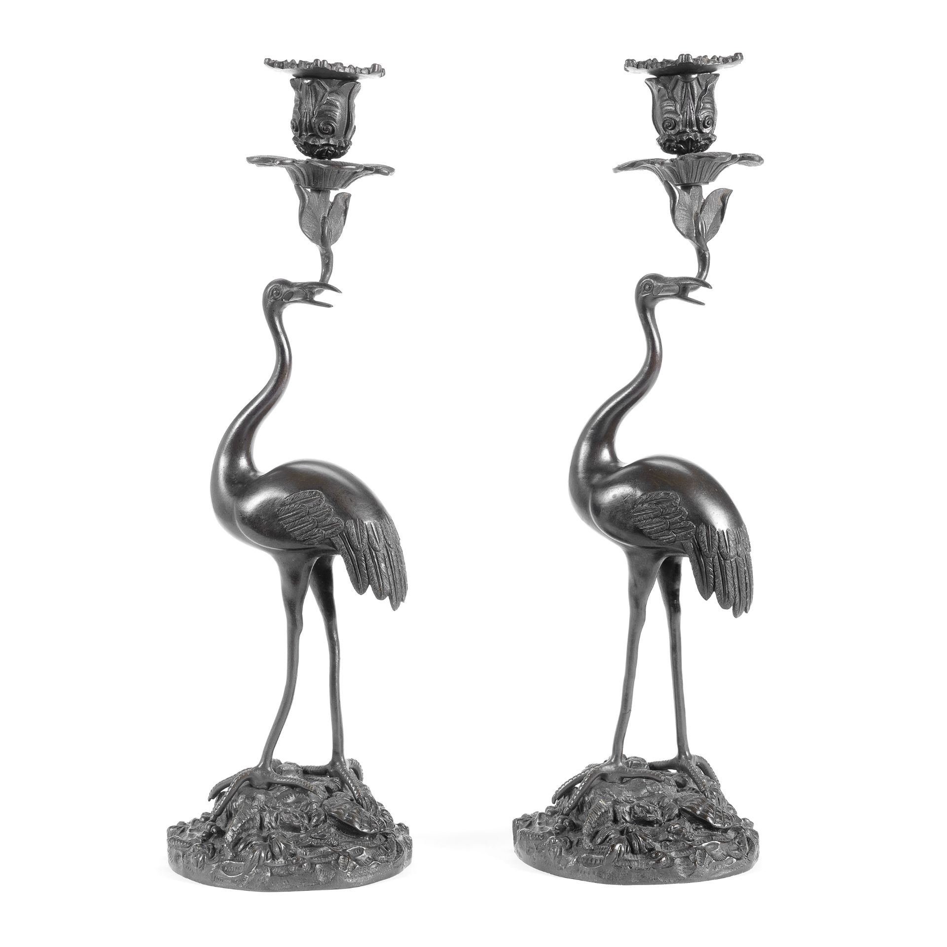 A pair of mid 19th century patinated bronze crane candlesticks in the manner of Thomas Abbott (2)