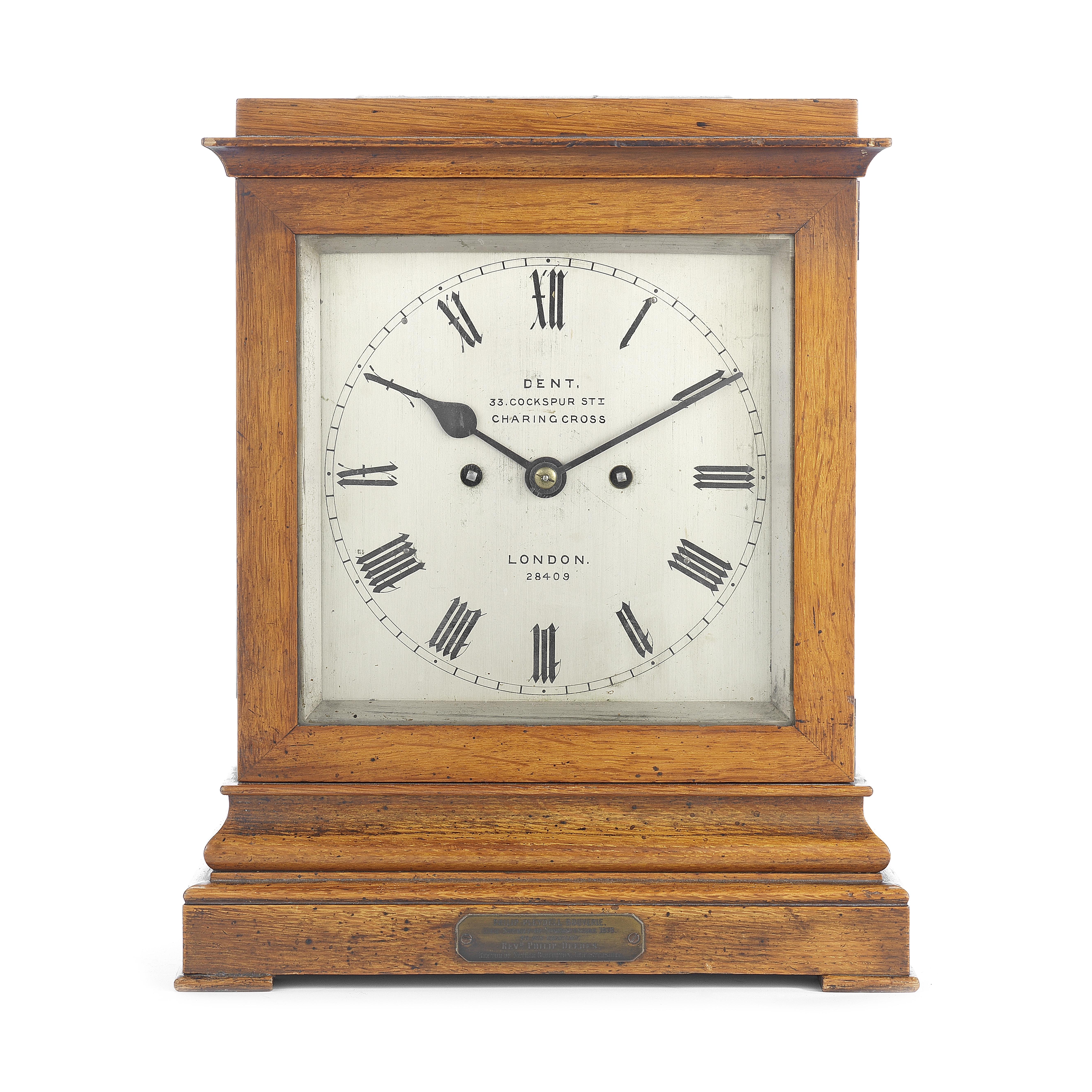 A good second half of the 19th century oak table clock with commemorative plaque the dial signed ...