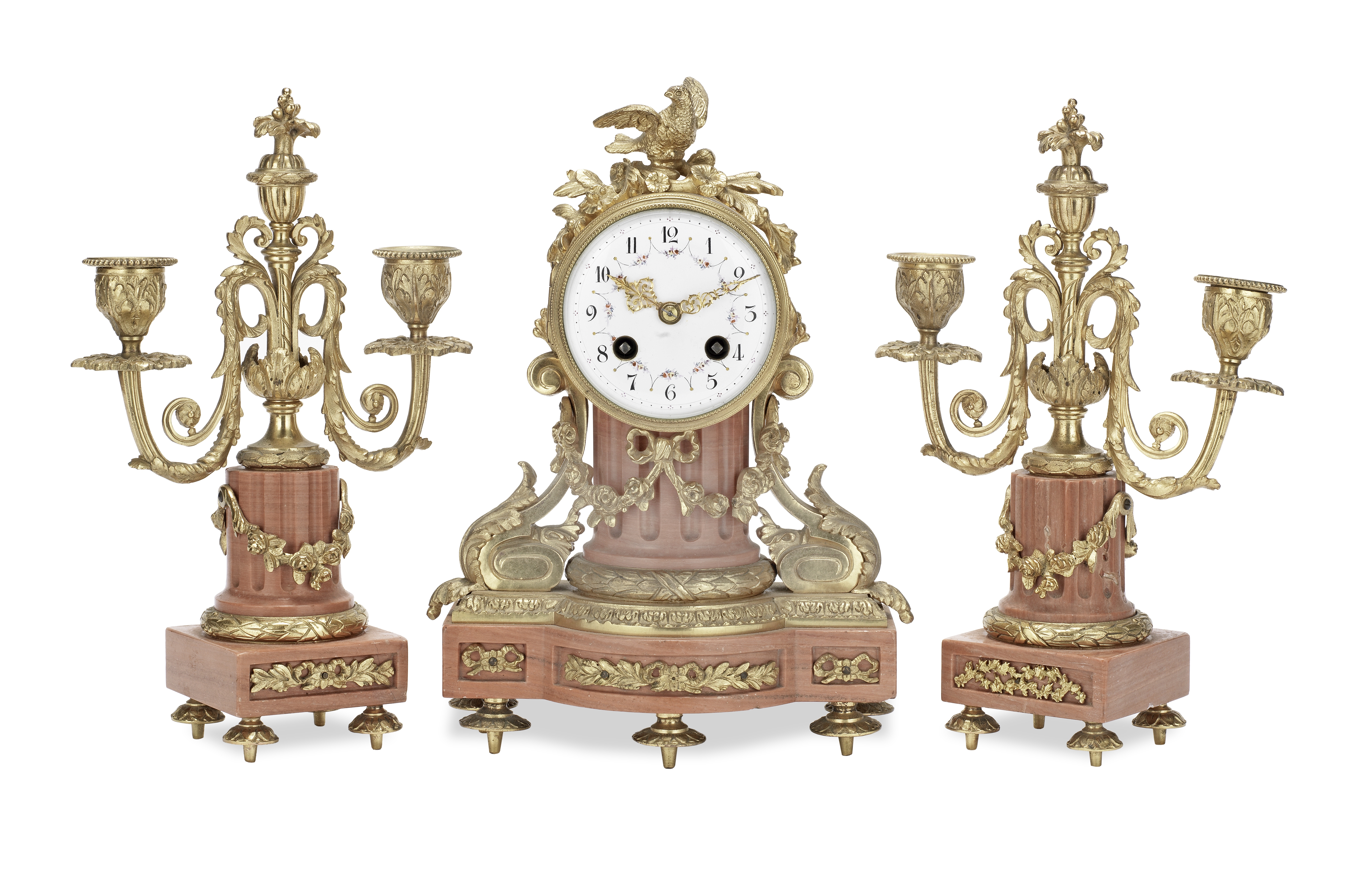 An early 20th century French gilt bronze and pink marble boudoir clock garniture in the Louis XVI...