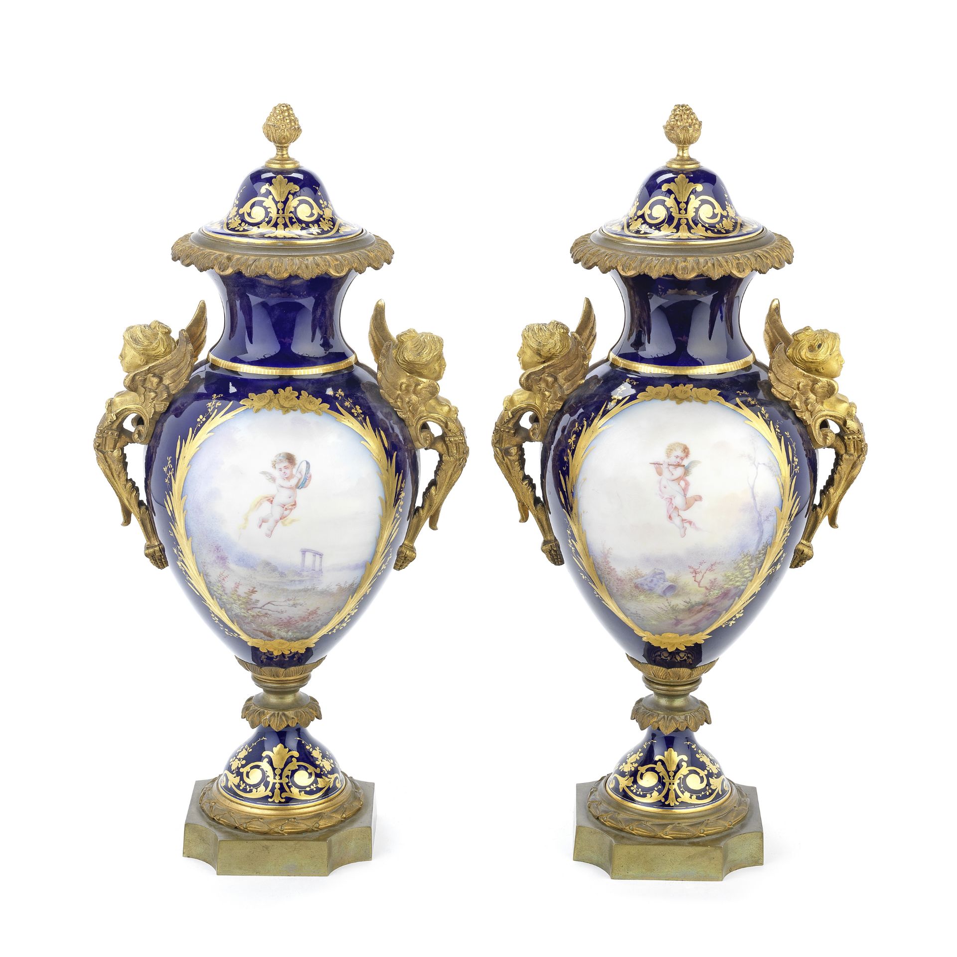 A pair of late 19th century French gilt bronze mounted S&#232;vres-style porcelain garniture vase...