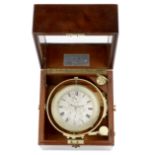 Thos Cogdon. A brass cased marine chronometer gimbal mounted in a wooden deck box Circa 1890