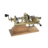 A hand cranked watchmaker's lathe, mid 19th century