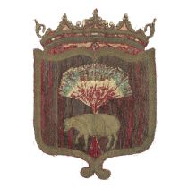 A shield shaped armorial of crimson silk 17th century, possibly French