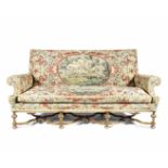 A Carolean style walnut and needlework upholstered sofa The upholstery, 18th century, the frame, ...