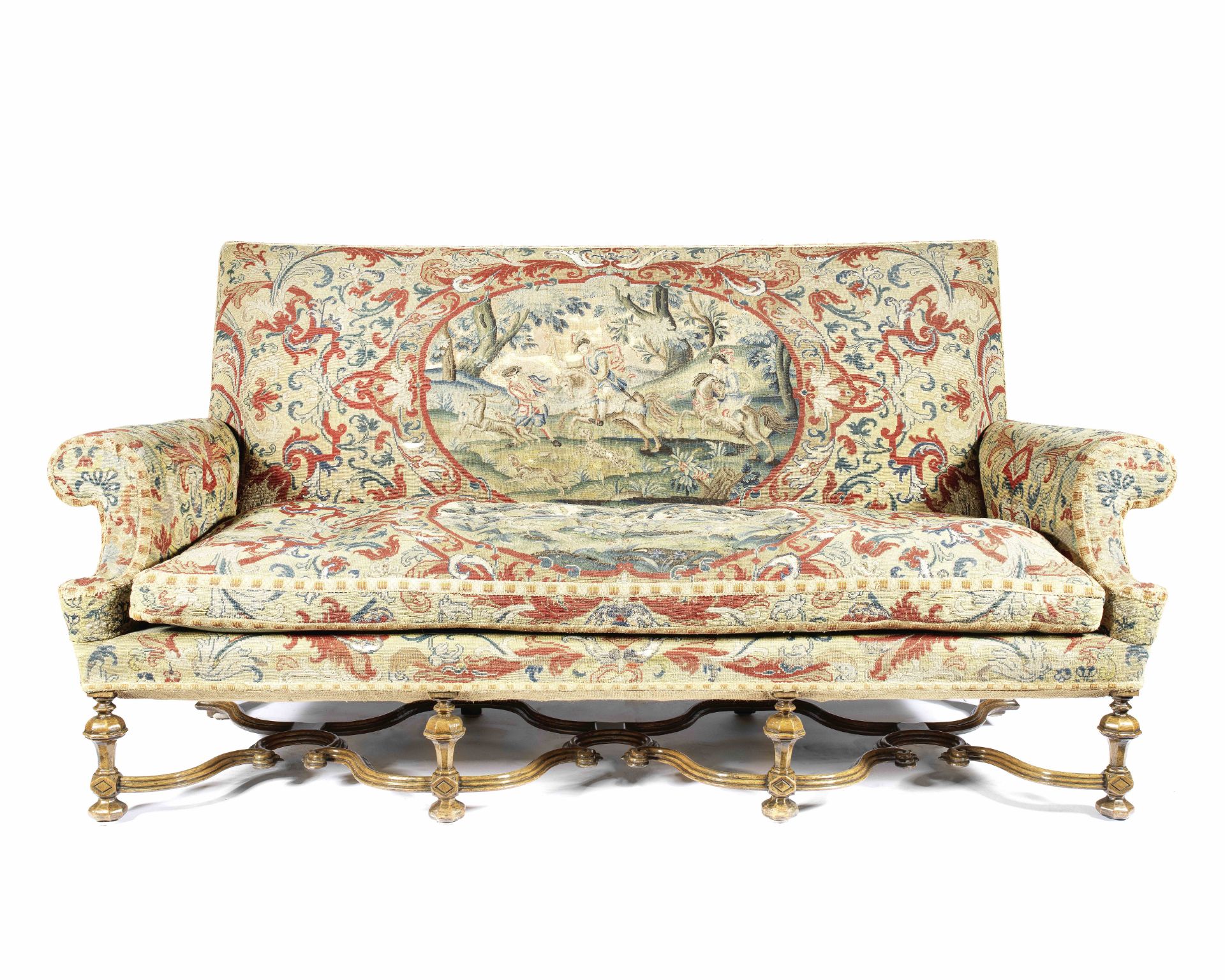 A Carolean style walnut and needlework upholstered sofa The upholstery, 18th century, the frame, ...