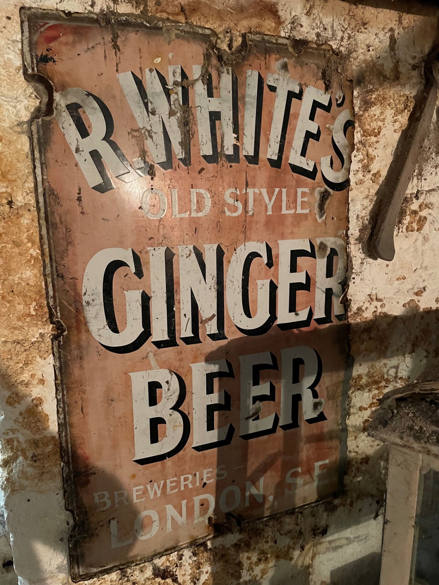 An 'R.Whites Old Style Ginger Beer' enamel sign,