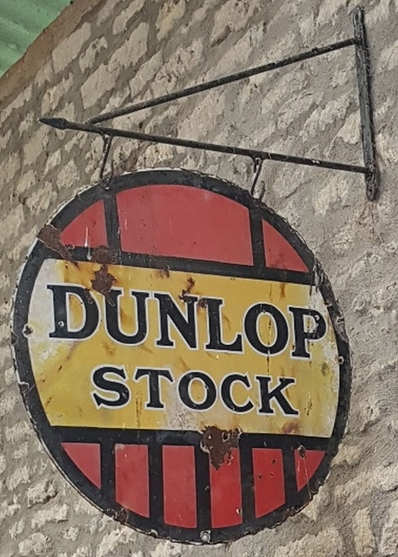 A Dunlop Stock circular enamel sign,