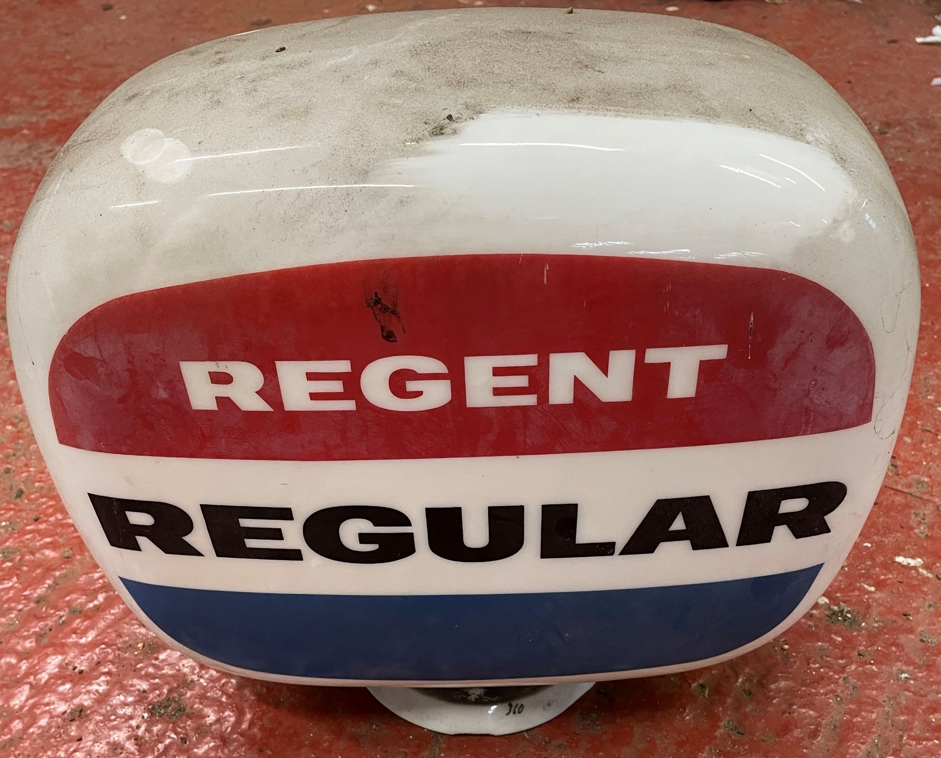 A Regent Regular glass petrol pump globe,
