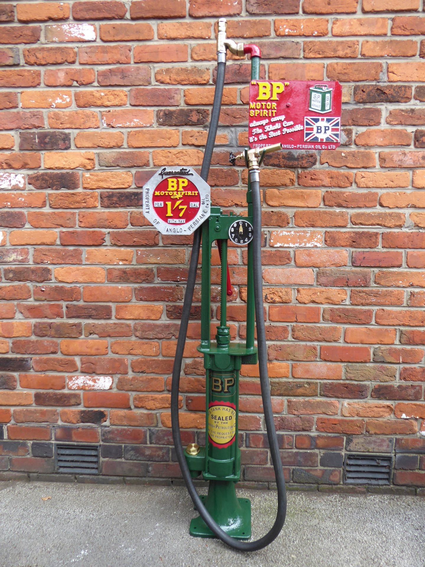 An early Wayne hand-operated petrol pump,