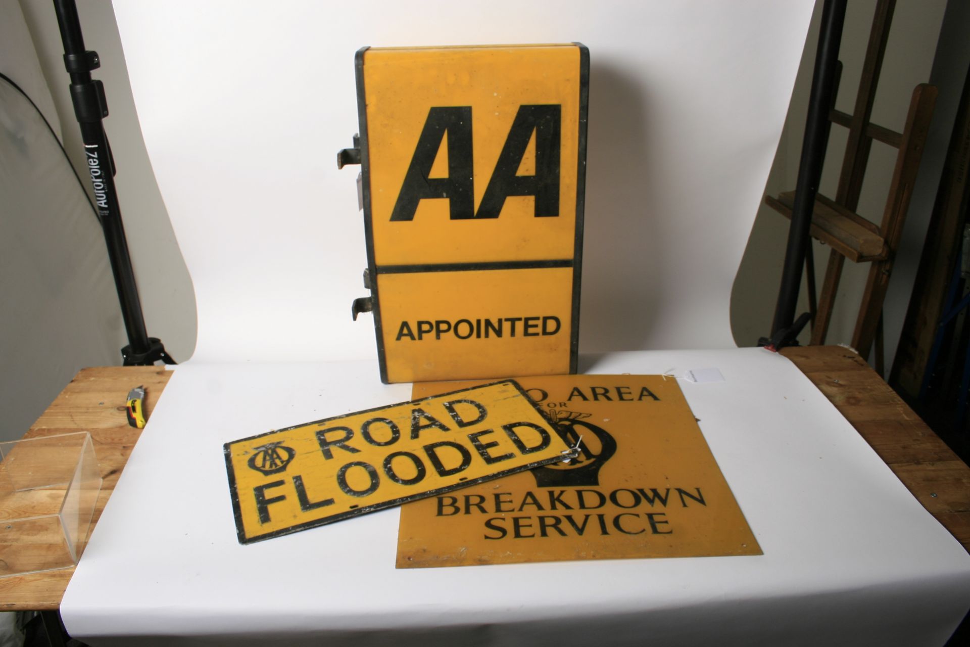 Three Automobile Association signs,