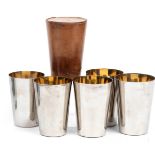 A vintage leather-cased set of five graduated beakers,