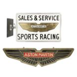 An 'Aston Martin - Sales & Service Sports Racing' illuminating display sign, ((2))