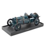 A 1:8 scale model of a 1914 Sunbeam TT race car,