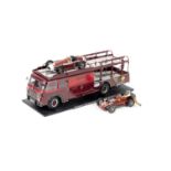 A 1:18 scale model of the 1957 Fiat 642 RN2 Bartoletti Ferrari Race Transporter by CMC Models of ...